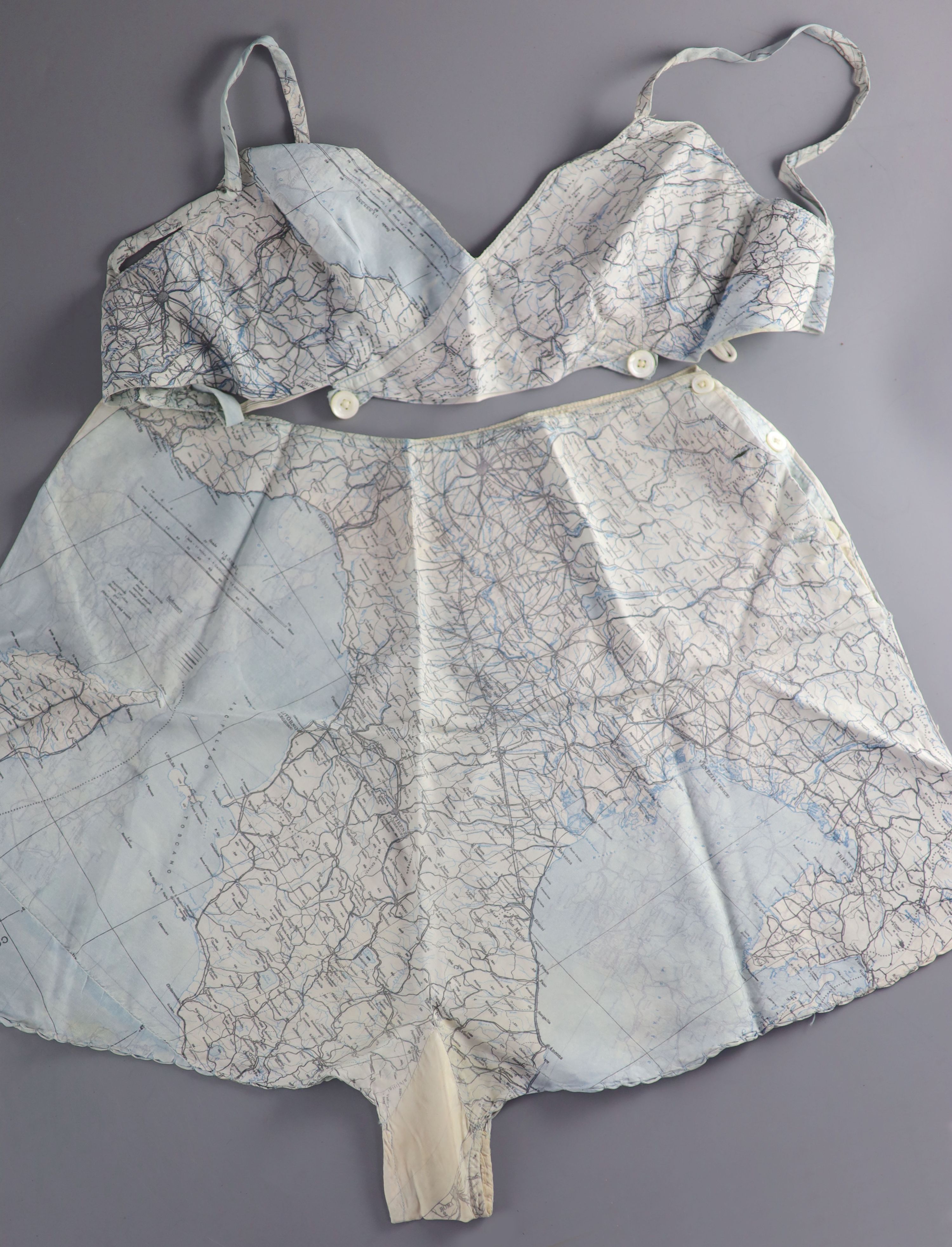 A novelty bra and cami knicker set, made from a silk printed escape map of Italy, used in the Second World War